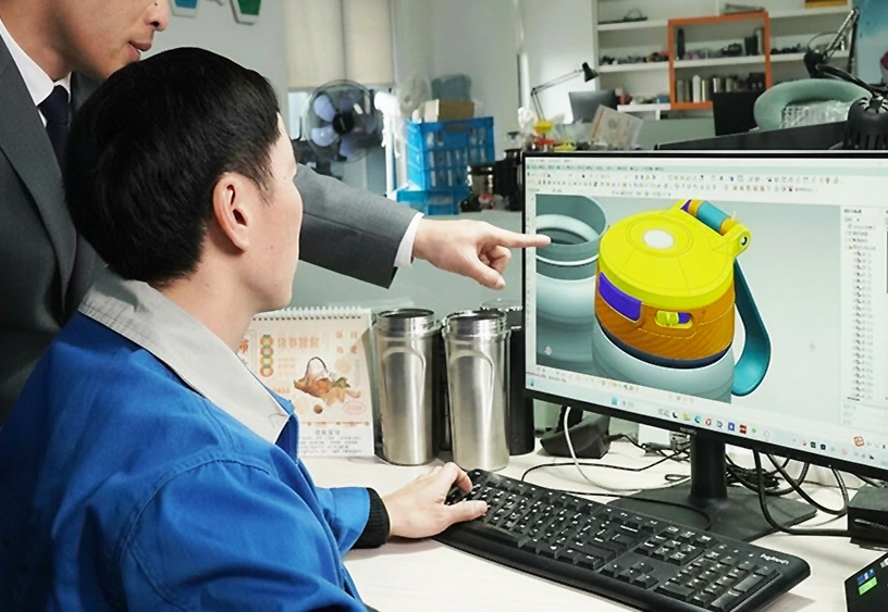 Engineers designing custom water bottle lid in CAD